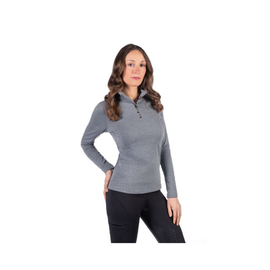 girl wearing blue mottled 1/4 zip long sleeve shirt with black riding tights equestrian fashion outfitters