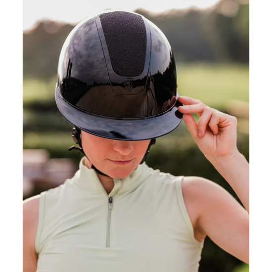 Girl with black shiny glossy helmet with black sparkle diamond top panel equestrian fashion outfitters