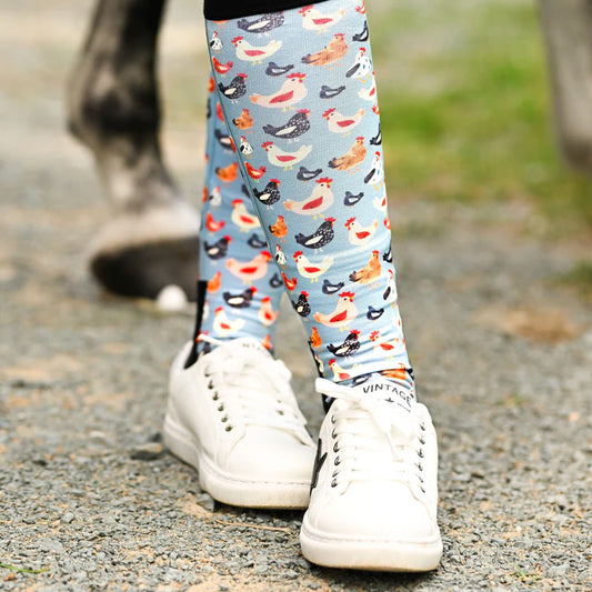 socks with chicken pattern worn by a person on a gravel path