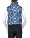 Person wearing a blue floral patterned puffer vest on a white background kastel equestrian fashion outfitters