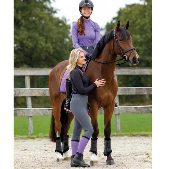 girl on brown horse with purple saddle pad and purple knee socks equestrian fashion outfitters