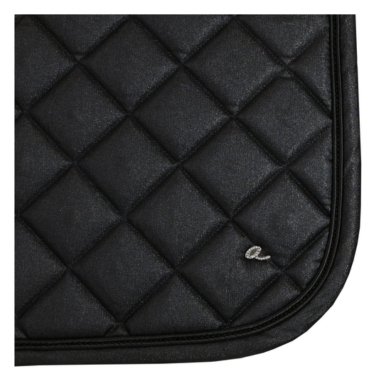 Close-up of a black quilted saddle pad with diamond stitching and a small silver embroidered logo, shown on a white background. equestrian fashion outfitters