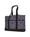 A tote bag with a dark gray and purple repeating bow pattern, featuring black shoulder straps, black trim, and a black bottom base. equestrian fashion outfitters