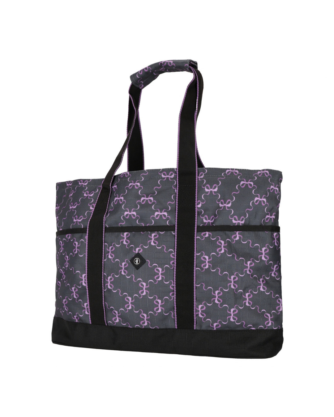 A tote bag with a dark gray and purple repeating bow pattern, featuring black shoulder straps, black trim, and a black bottom base. equestrian fashion outfitters