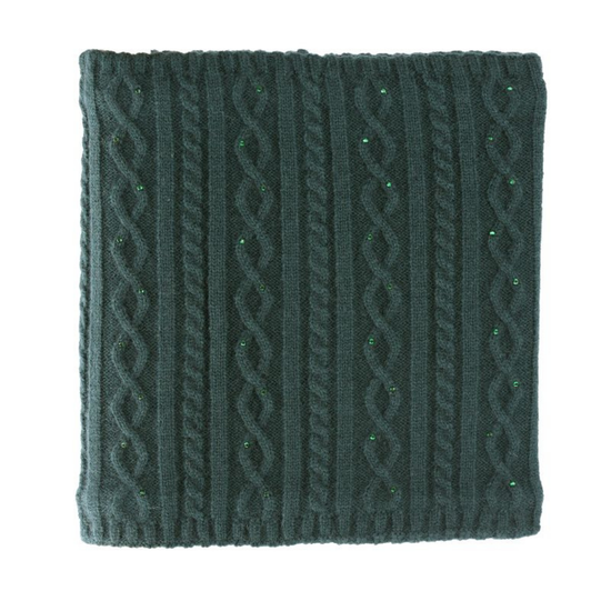 A square dark green cable-knit fabric accessory, a scarf or snood or neck warmer featuring vertical and diagonal cable patterns with small green glitter accents, shown on a plain white background. equestrian fashion outfitters