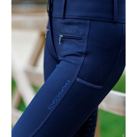 Navy blue equestrian pants  breeches with a visible brand logo background schockemohle equestrian fashion outfitters
