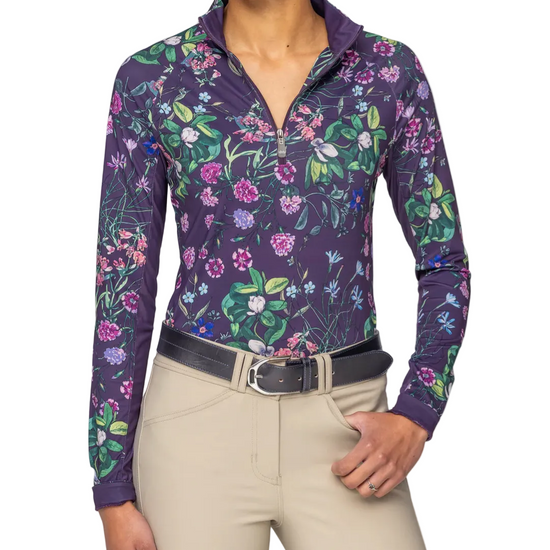 Woman wearing a floral-patterned long-sleeve shirt with a white background equestrian fashion outfitters