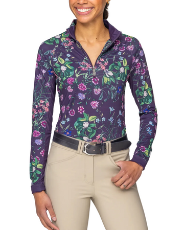 Woman wearing a floral-patterned long-sleeve shirt with a white background equestrian fashion outfitters