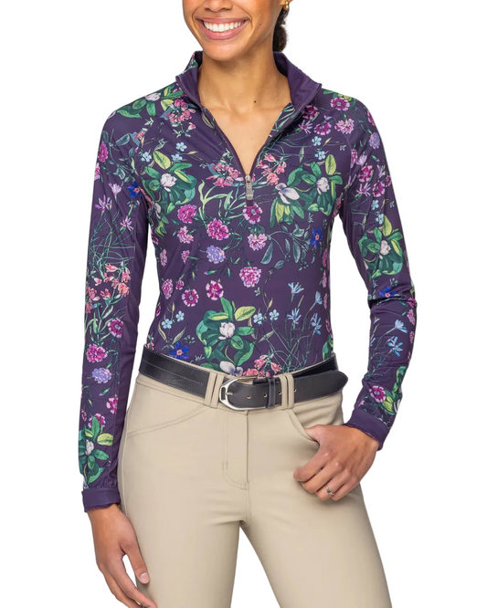 Woman wearing a floral-patterned long-sleeve shirt with a white background equestrian fashion outfitters