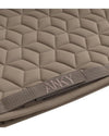 Quilted beige khaki pad with a strap featuring the brand name Anky on a white background